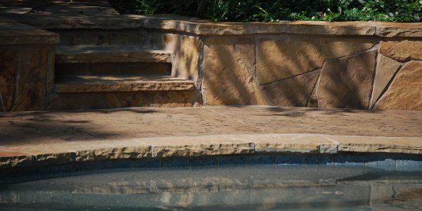 beautiful stone pool deck remodeled in north dallas