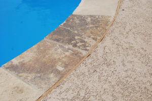 pool tile in need of repair at a north dallas pool