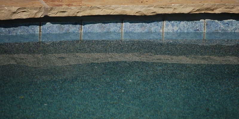 Closeup view of flagstone natural tile in dallas pool
