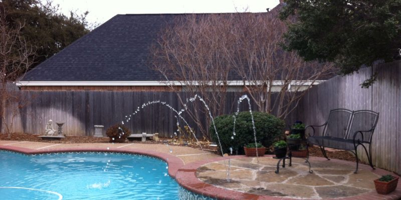 swimming pool design with water features in north dallas